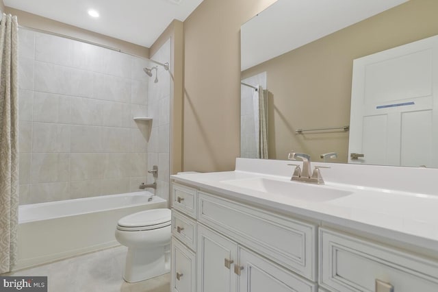 full bathroom featuring shower / bath combination with curtain, vanity, and toilet