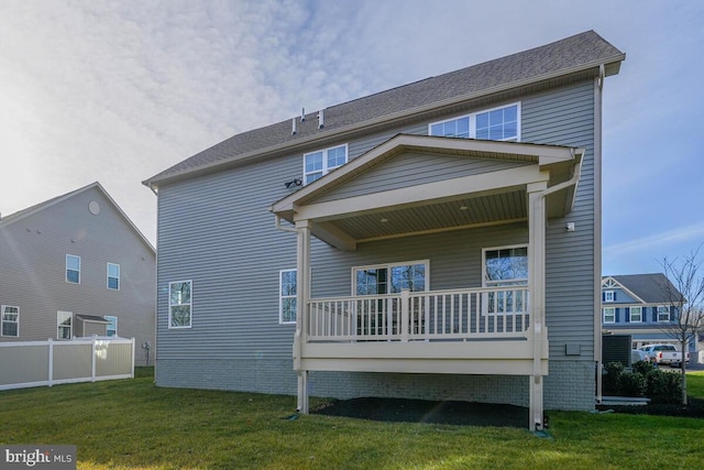 back of property featuring a lawn