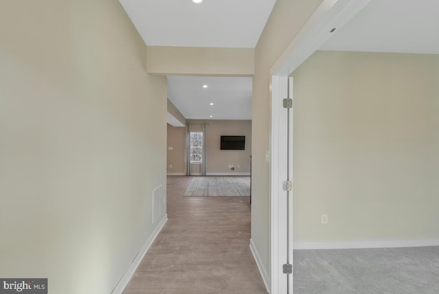 corridor featuring light hardwood / wood-style flooring