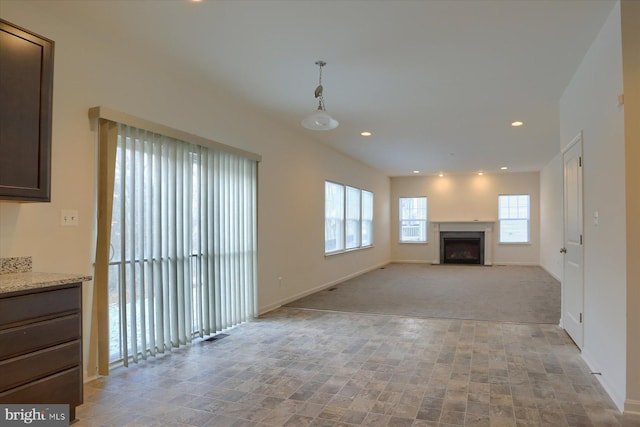 unfurnished living room with light carpet