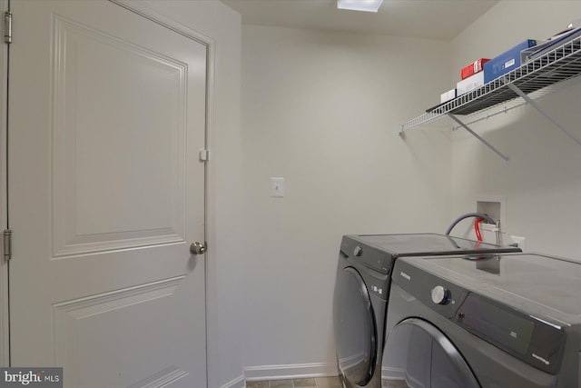 washroom with separate washer and dryer