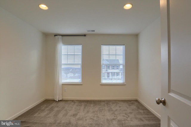 view of carpeted spare room