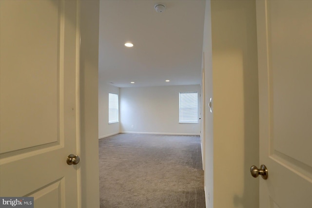 hall featuring carpet floors