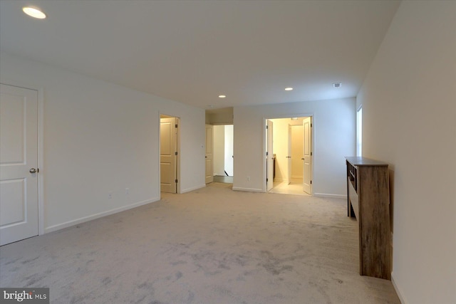 empty room featuring light colored carpet