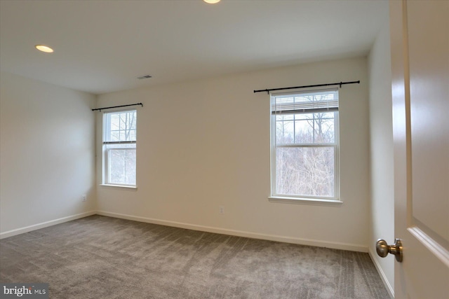 unfurnished room featuring carpet floors