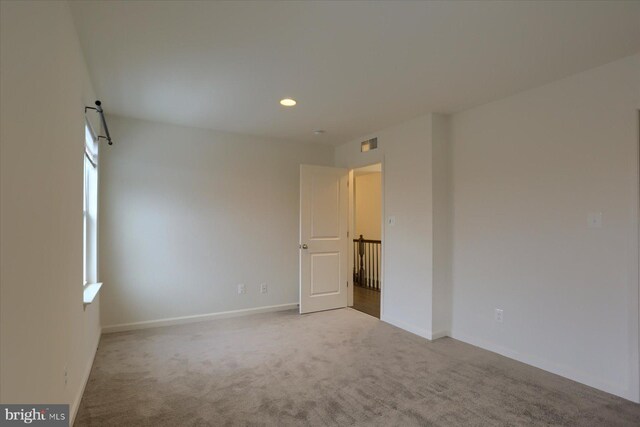 empty room with carpet flooring