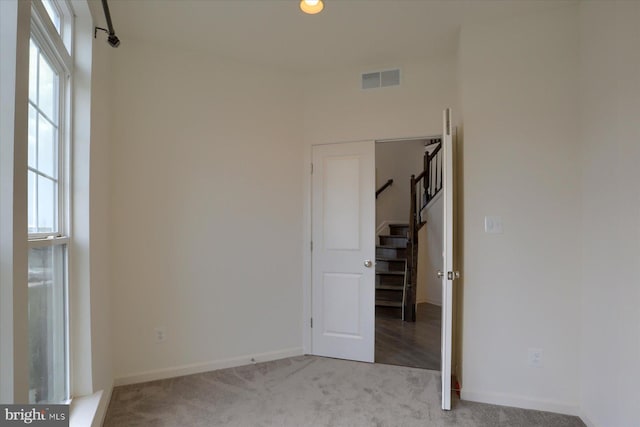 empty room with light colored carpet