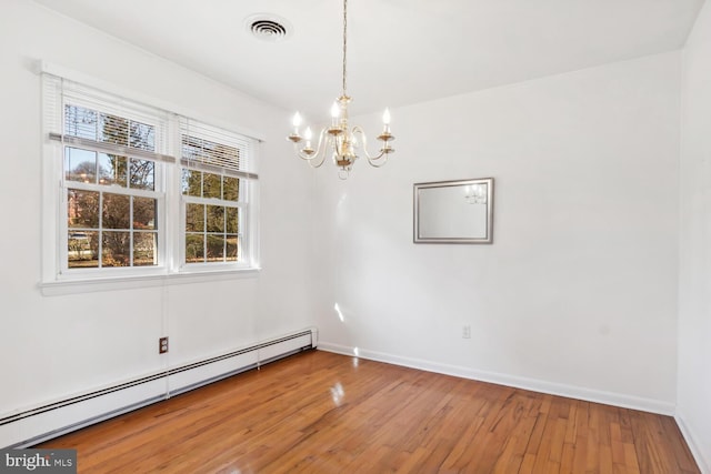 unfurnished dining area with hardwood / wood-style flooring, baseboard heating, and a chandelier