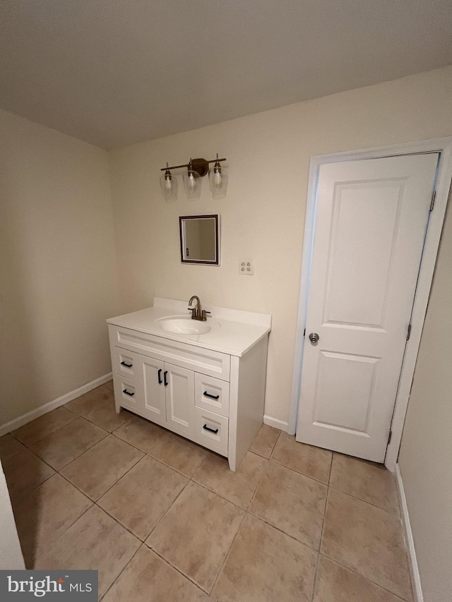 bathroom with tile patterned flooring and vanity