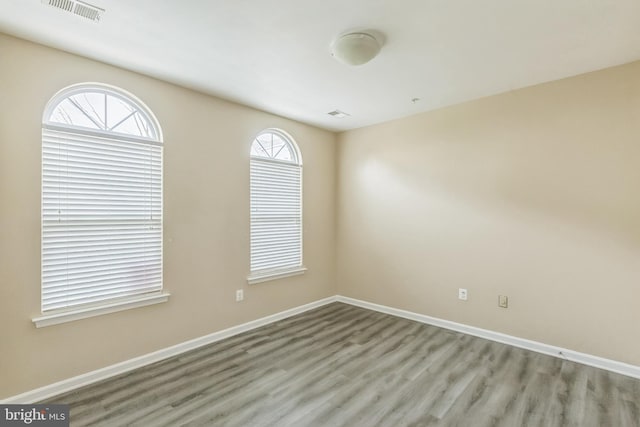 spare room with light wood-type flooring