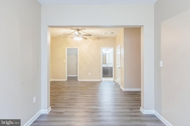 spare room featuring ceiling fan and light wood-type flooring