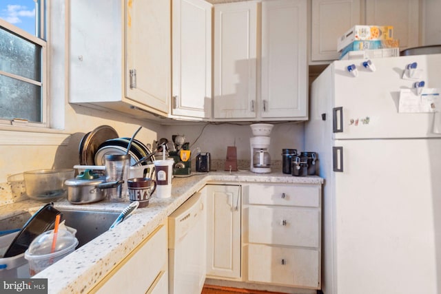 kitchen with white appliances and sink