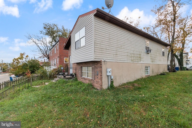 view of home's exterior featuring a yard