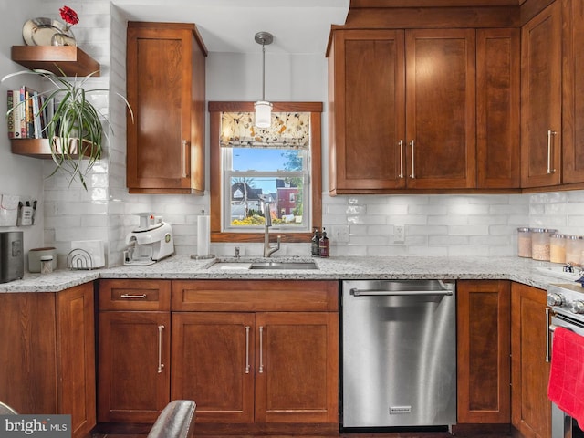 kitchen featuring decorative backsplash, appliances with stainless steel finishes, light stone countertops, and sink