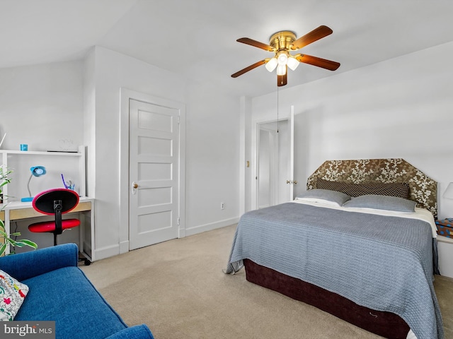 carpeted bedroom featuring ceiling fan and lofted ceiling