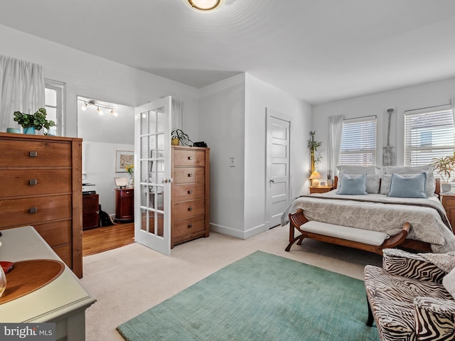 bedroom with light colored carpet