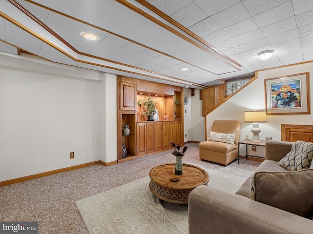 carpeted living room featuring crown molding