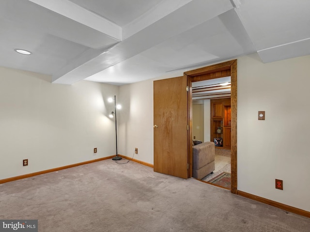 basement featuring light colored carpet