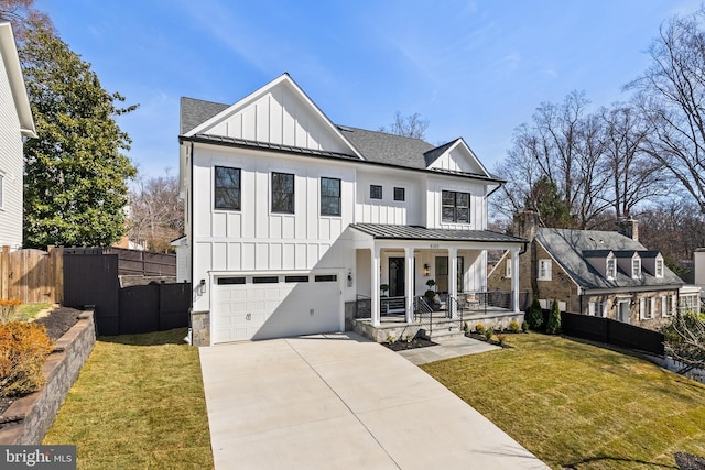 modern farmhouse style home with covered porch, board and batten siding, a shingled roof, and a standing seam roof