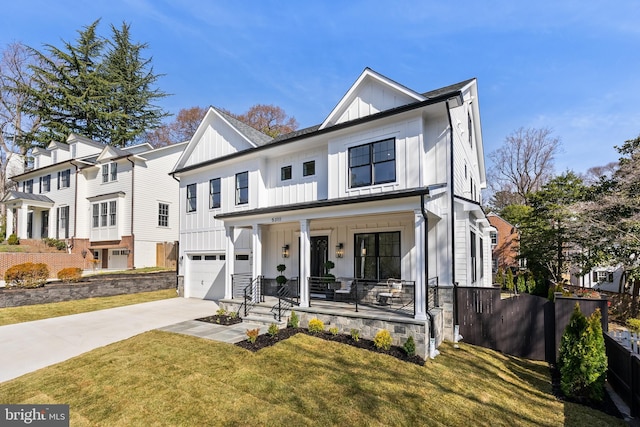 modern farmhouse style home featuring a porch, concrete driveway, a front lawn, a garage, and board and batten siding