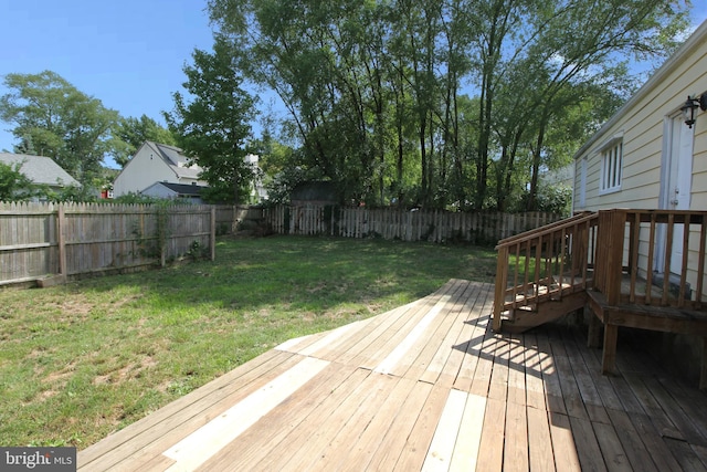 wooden terrace with a yard