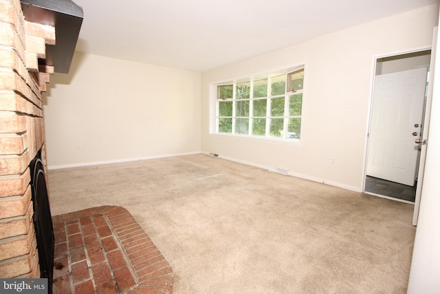 unfurnished room with carpet flooring