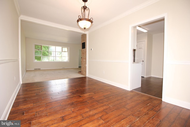 unfurnished room with crown molding and dark hardwood / wood-style flooring