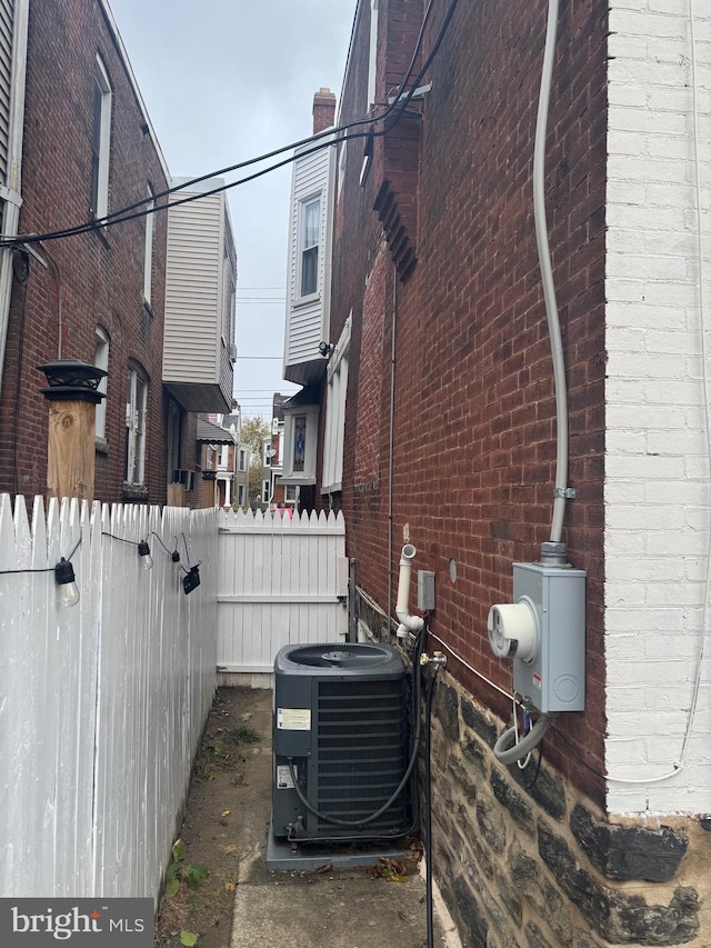 view of side of property with central AC unit