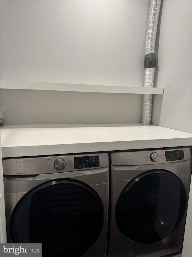 laundry room featuring washing machine and dryer