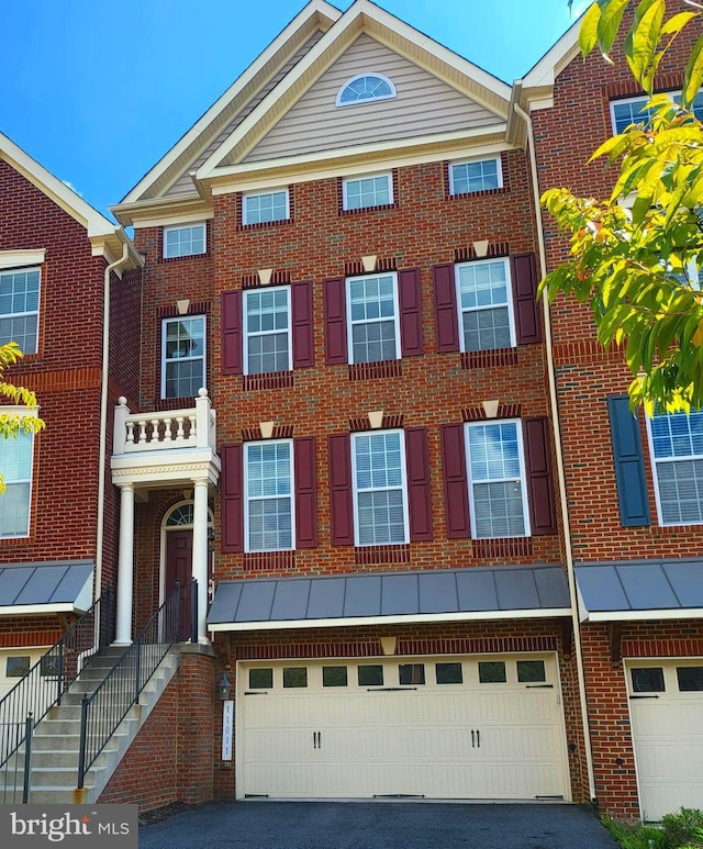 multi unit property featuring a garage