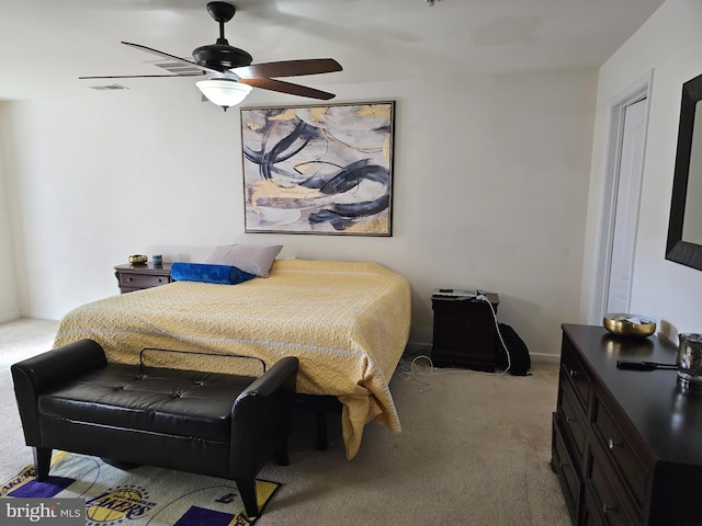 bedroom featuring carpet floors, baseboards, visible vents, and a ceiling fan