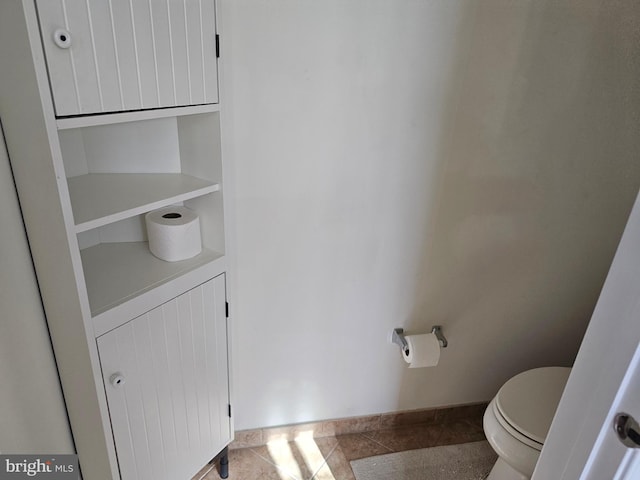 bathroom featuring toilet and tile patterned floors