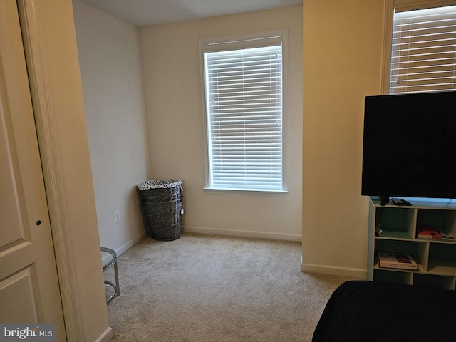 carpeted bedroom with baseboards