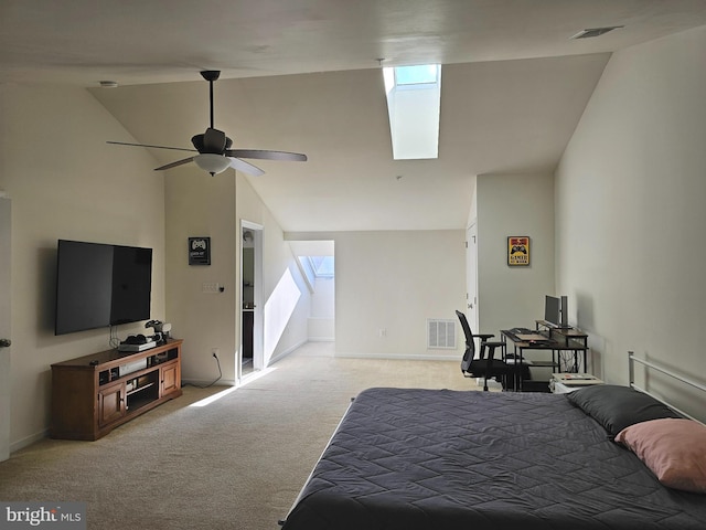 bedroom featuring a skylight, light carpet, visible vents, and multiple windows