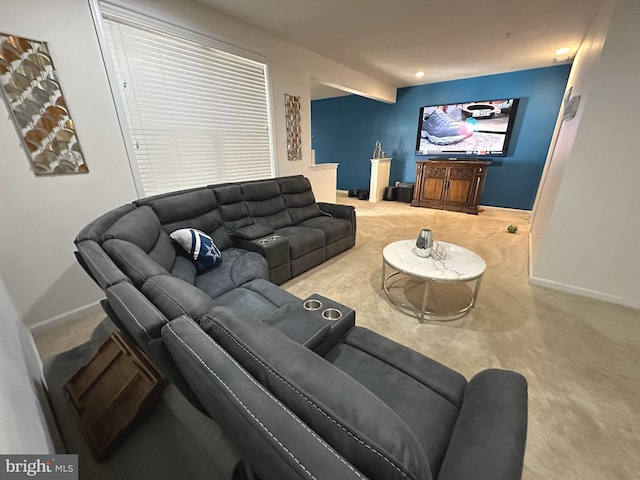 living area featuring baseboards