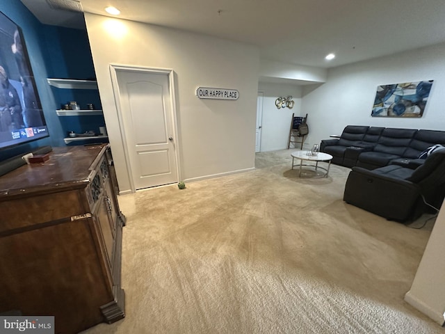 living room featuring recessed lighting, light colored carpet, and baseboards