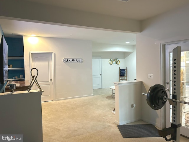 interior space with carpet and baseboards