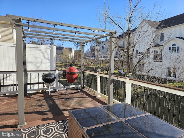 wooden terrace with a pergola