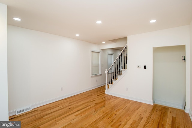 spare room with light hardwood / wood-style flooring