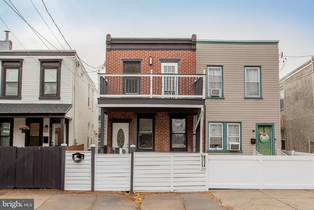 townhome / multi-family property featuring a balcony