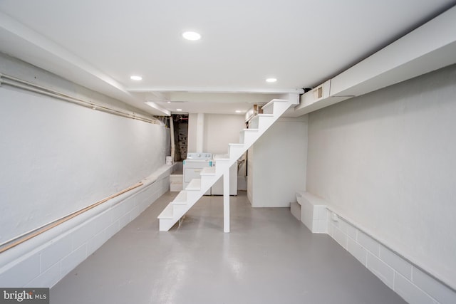 basement with washer and clothes dryer