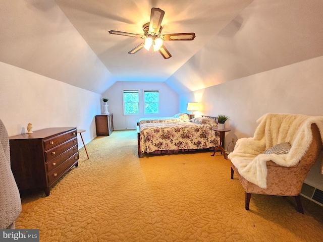 carpeted bedroom with ceiling fan and lofted ceiling