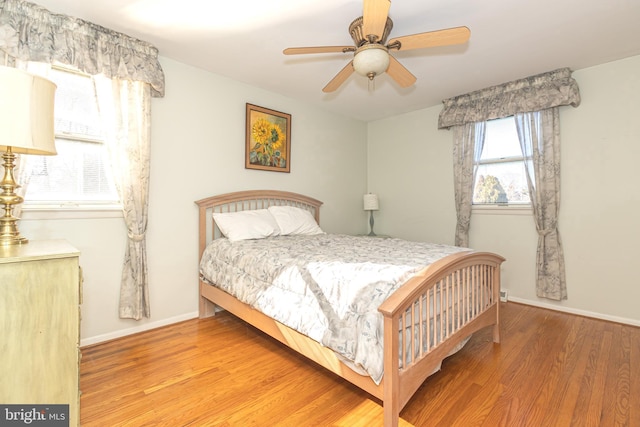 bedroom featuring ceiling fan and hardwood / wood-style flooring