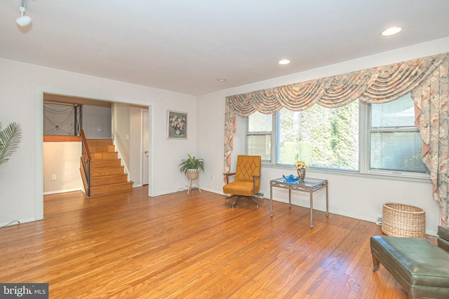 sitting room with hardwood / wood-style floors