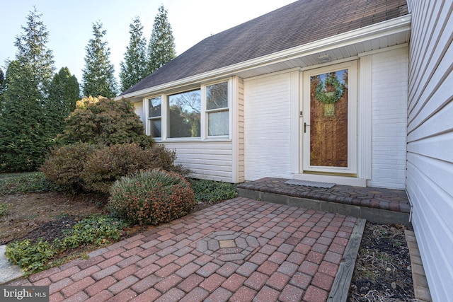 doorway to property with a patio