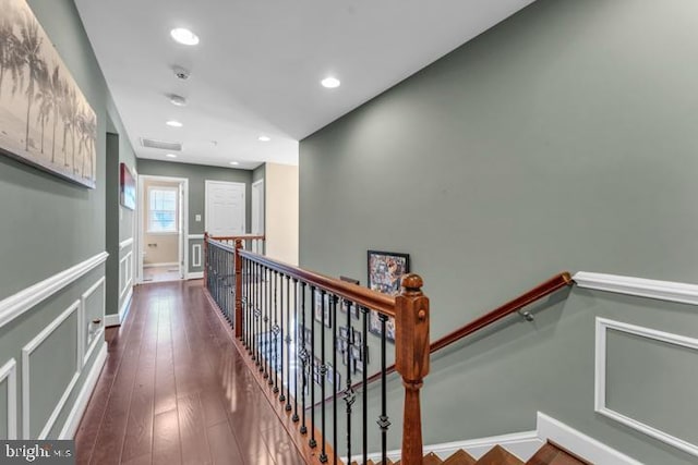 corridor featuring dark hardwood / wood-style flooring