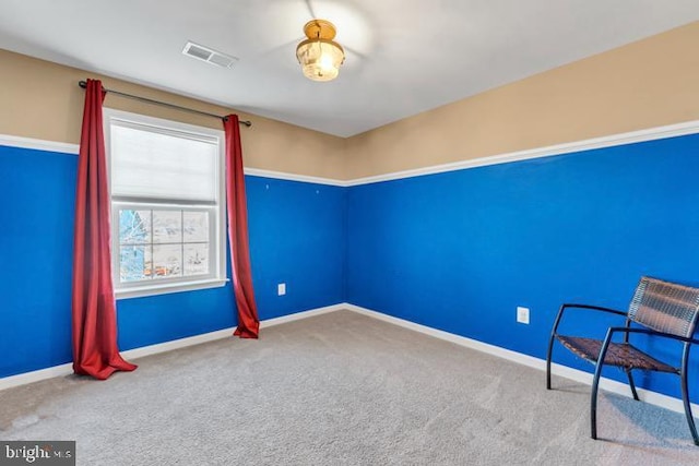 unfurnished room with carpet flooring