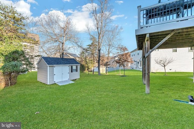 view of yard with a shed and a deck