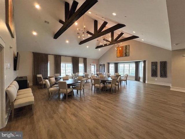 dining area with beam ceiling, high vaulted ceiling, dark wood-type flooring, and a notable chandelier