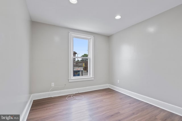 spare room featuring hardwood / wood-style flooring